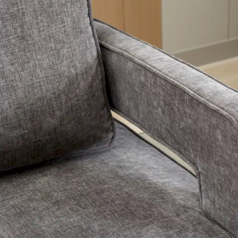Sillón moderno tapizado giratorio, con respaldo abierto tipo barril y cojín