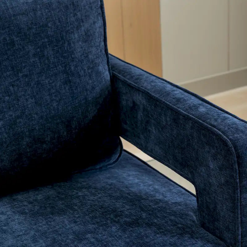 Sillón moderno tapizado giratorio, con respaldo abierto tipo barril y cojín