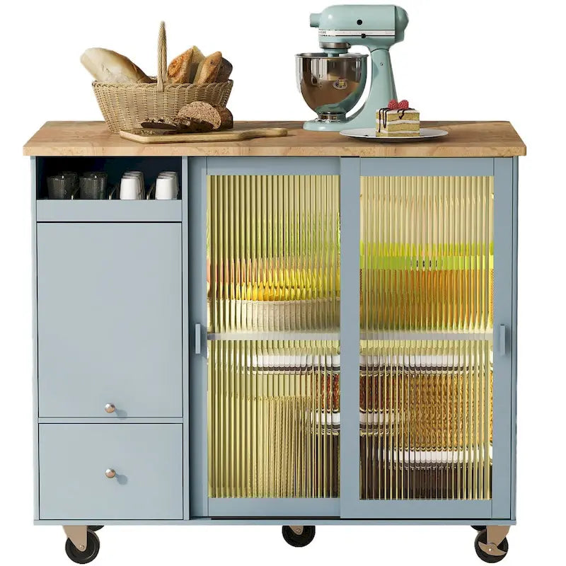 Isla de cocina con superficie abatible, luz LED, puertas de vidrio estriado, estante ajustable, dos cajones y ruedas
