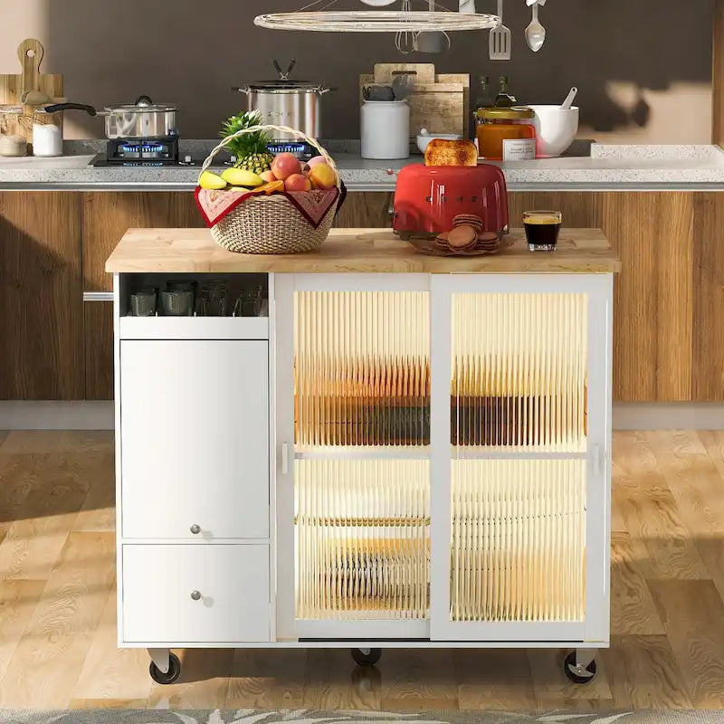 Isla de cocina con superficie abatible, luz LED, puertas de vidrio estriado, estante ajustable, dos cajones y ruedas